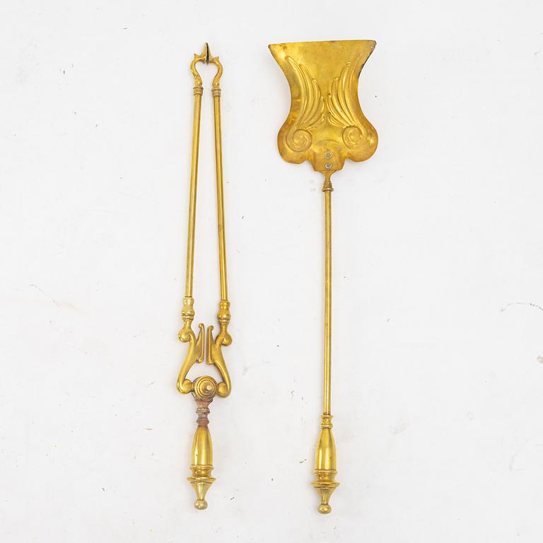 A four piece brass fire set, early 20th Century.