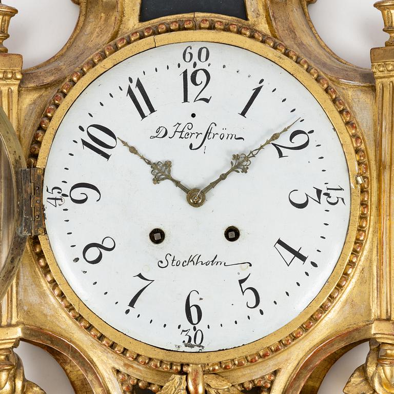 A Gustavian wall clock marked Daniel Herrström (active in Stockholm 1788-1790).