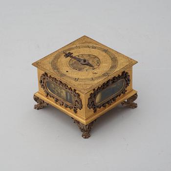 A Baroque 17th century traweller's clock in original case.