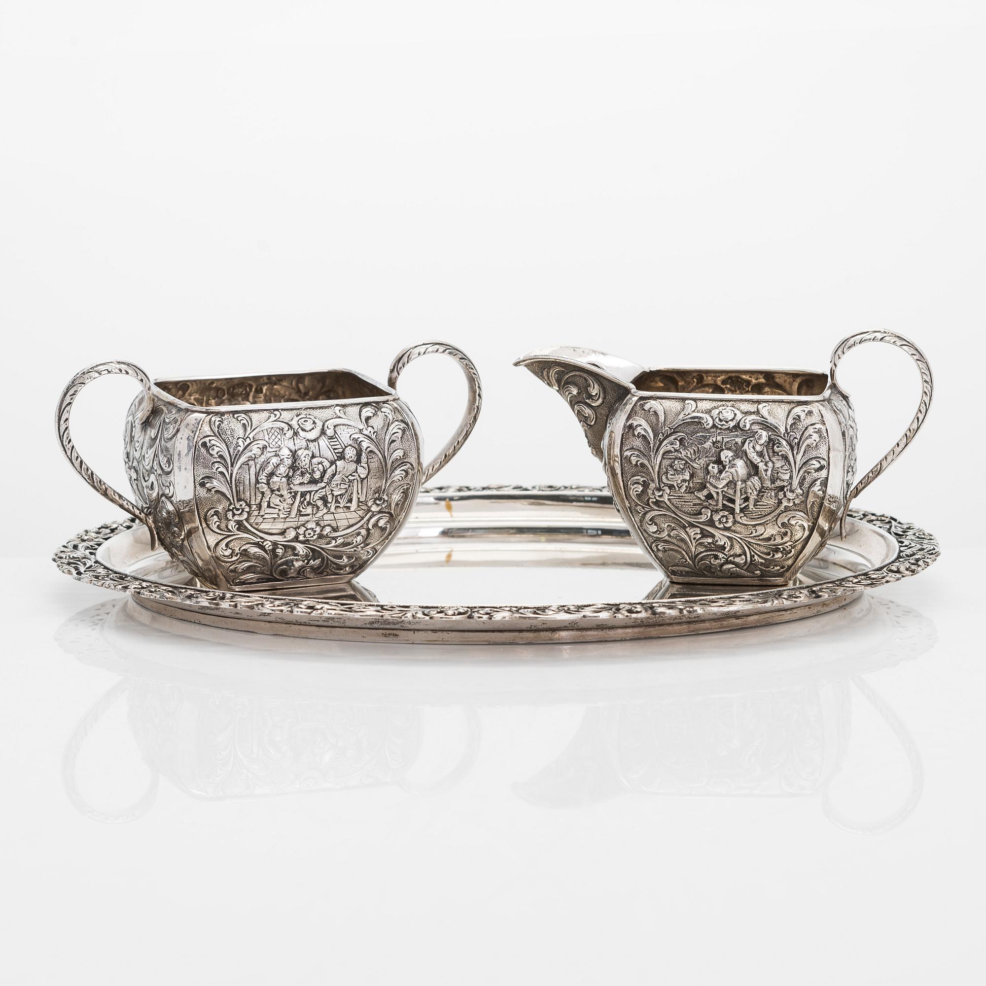 A 1940s Dutch silver sugar bowl and cream jug on a tray, Amsterdam, 1947 and 1942.
