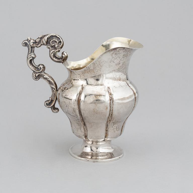 A Swedish 19th century parcel-gilt silver cream-jug, mark of Oskar Ahlström, Södertälje 1856.