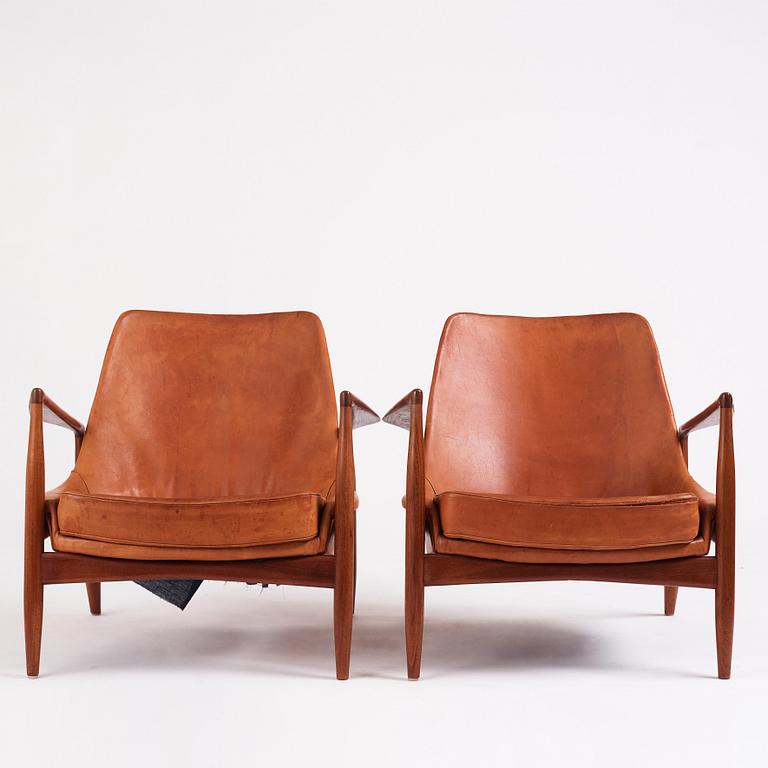 Ib Kofod-Larsen, a pair of teak and cognac coloured leather "Sälen" easy chairs, Olof Perssons Fåtöljindustri (OPE), Sweden, 1950-60's.