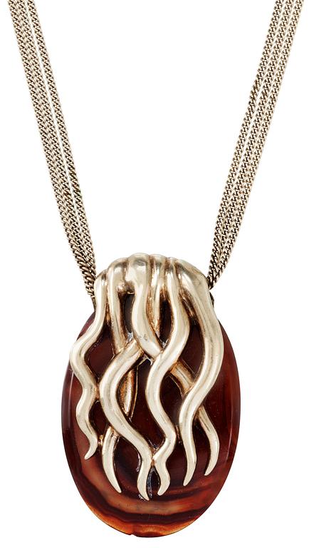 An Estrid Ericson amber and gilt pewter pendant.
