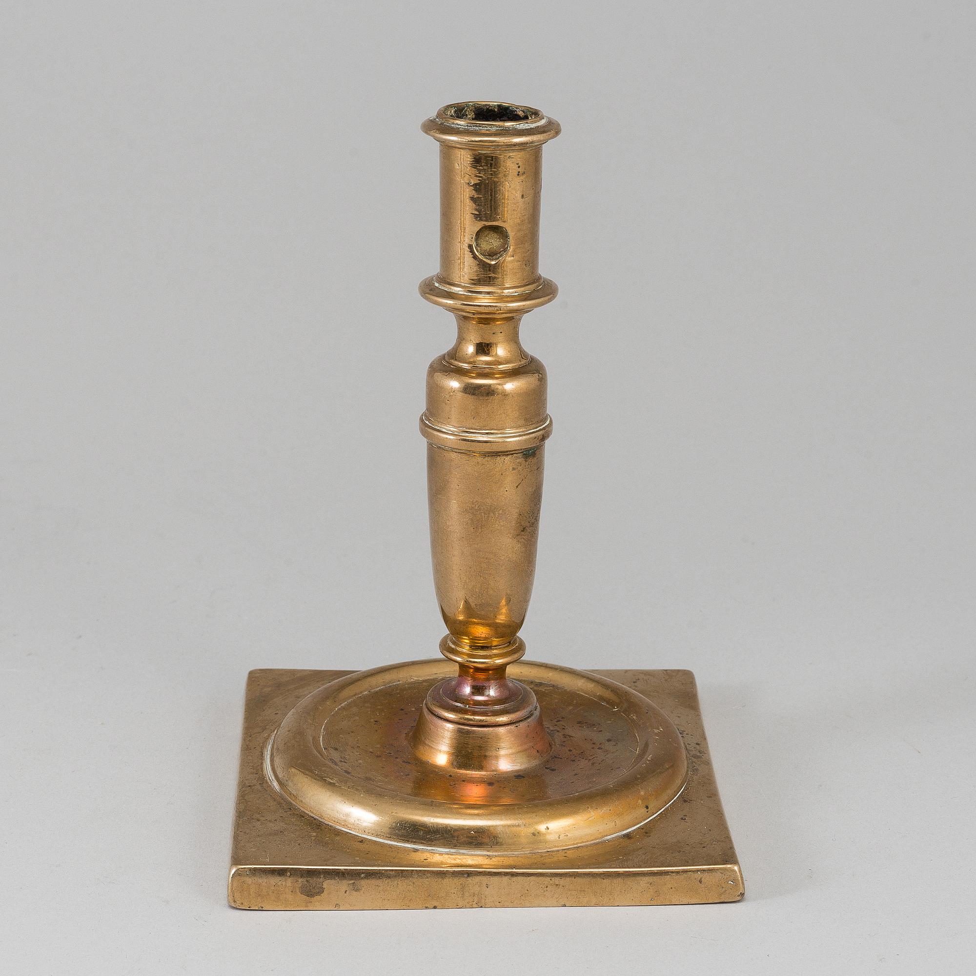 A 17th century bronze candlestick.