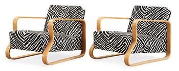 A pair of Alvar Aalto 'Padded Paimio' closed-framed armchairs, by O.y Huonekalu-ja Rakennustyötehdas A.B for Artek.