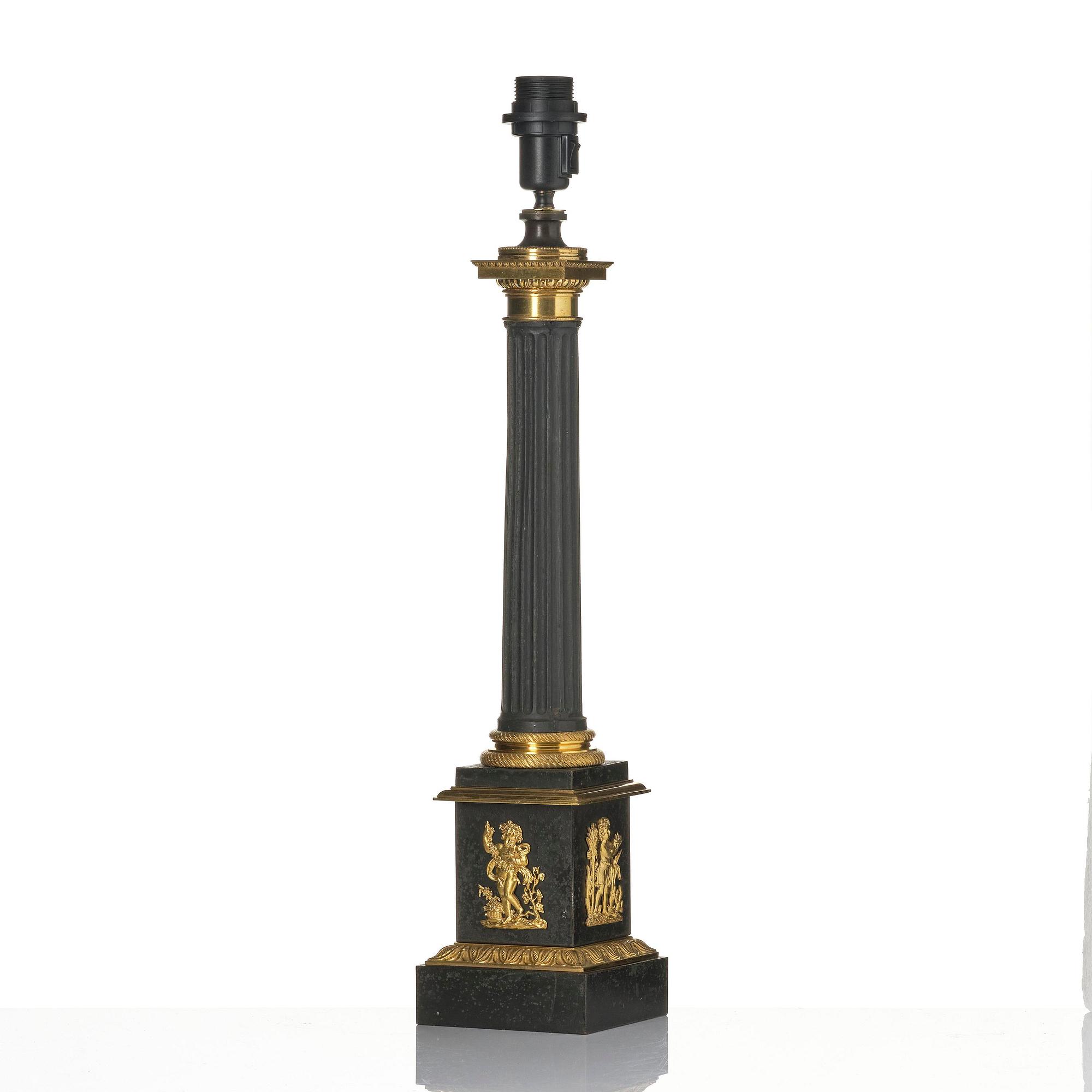 A French Empire ormolu and tole lamp, early 19th century.