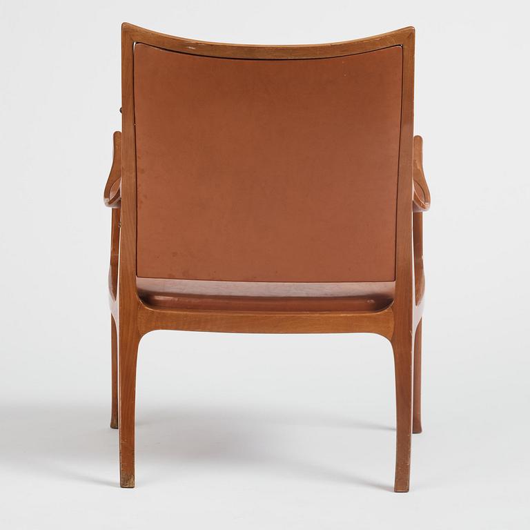 Hans Asplund, a walnut and leather easy chair, Nordiska Kompaniet, ca 1955, for the Nordiska Kompaniet beauty salon.