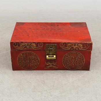 A Chinese red leather and wooden box, 20th century.