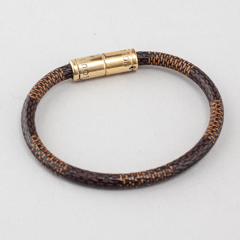 A bracelet by Louis Vuitton.