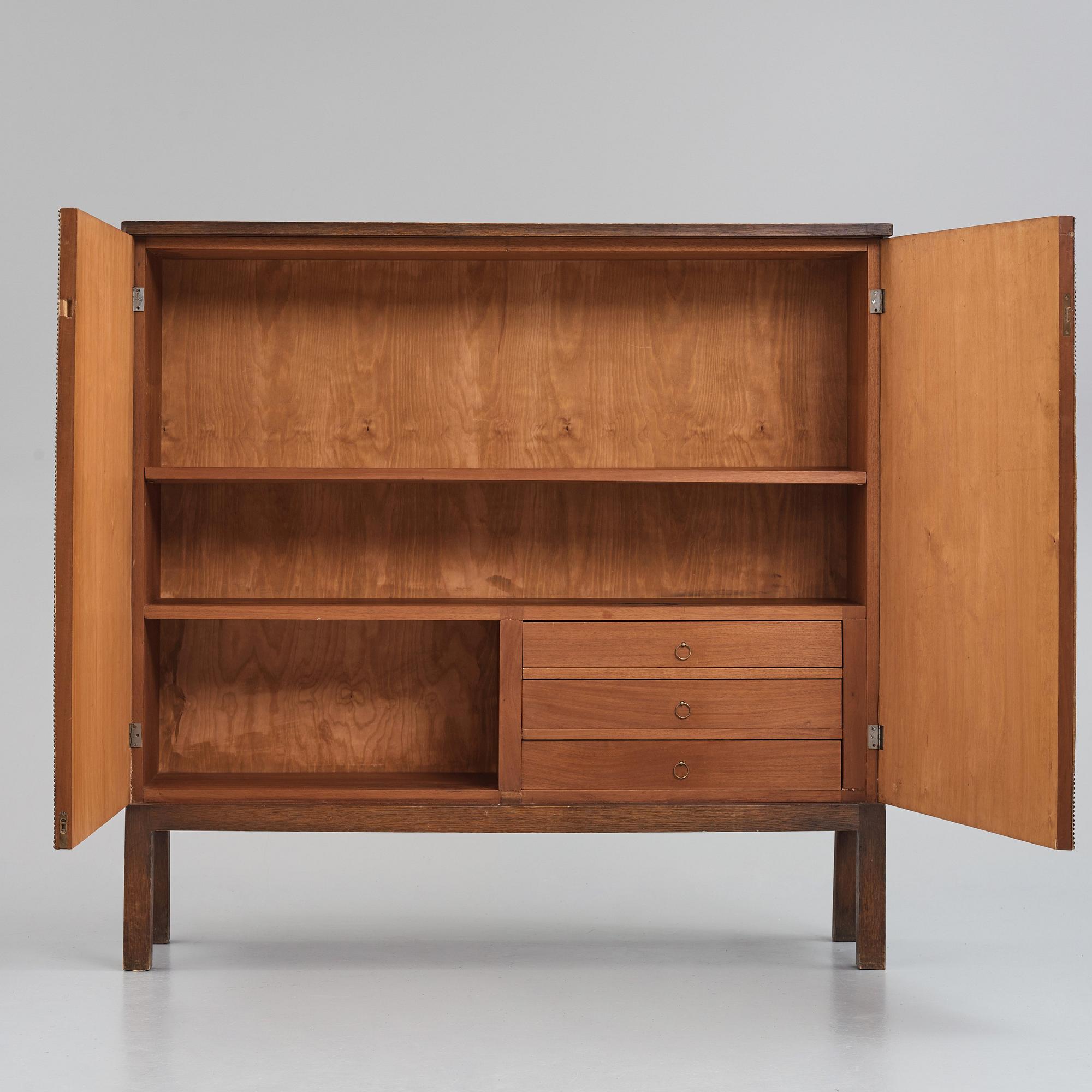 Otto Schulz, a Swedish Modern Zodiac patterned cabinet for Boet, Gothenburg, 1930-1940s.