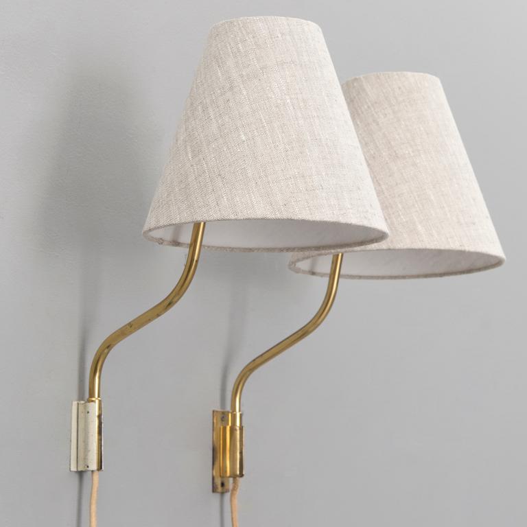 A pair of mid-20th century '3053' wall lights for Stockmann Orno, Finland.