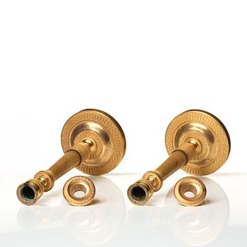 A pair of Empire candlesticks.