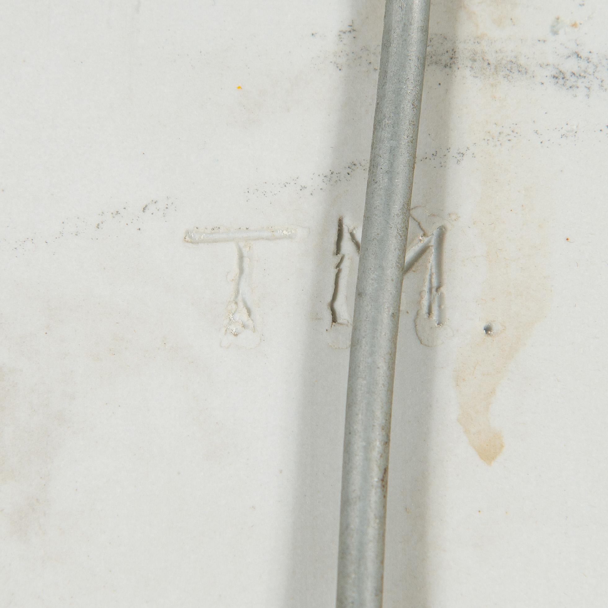 Toini Muona, a stoneware relief signed TM Arabia.