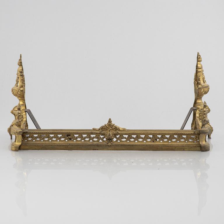 A pair of Louis XVI-style bronze andirons, France, later part of the 19th century.