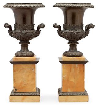 721. A pair of French mid 19th century patinated bronze and Siena marble tazza.
