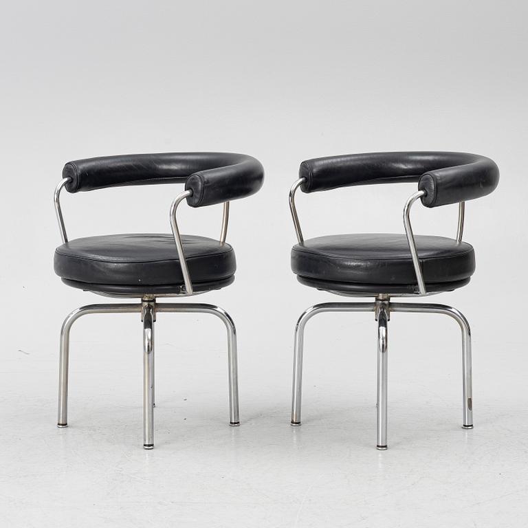 Charlotte Perriand, /Le Corbusier, swivel armchairs, a pair, model LC7, Cassina, Italy, later part of the 20th century.