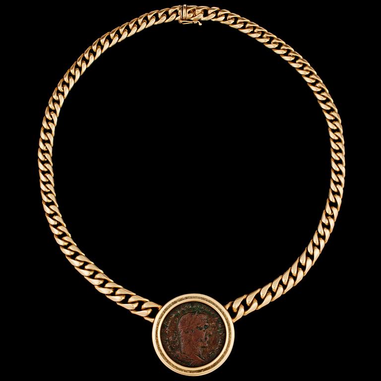 A gold chain and antique coin necklace.