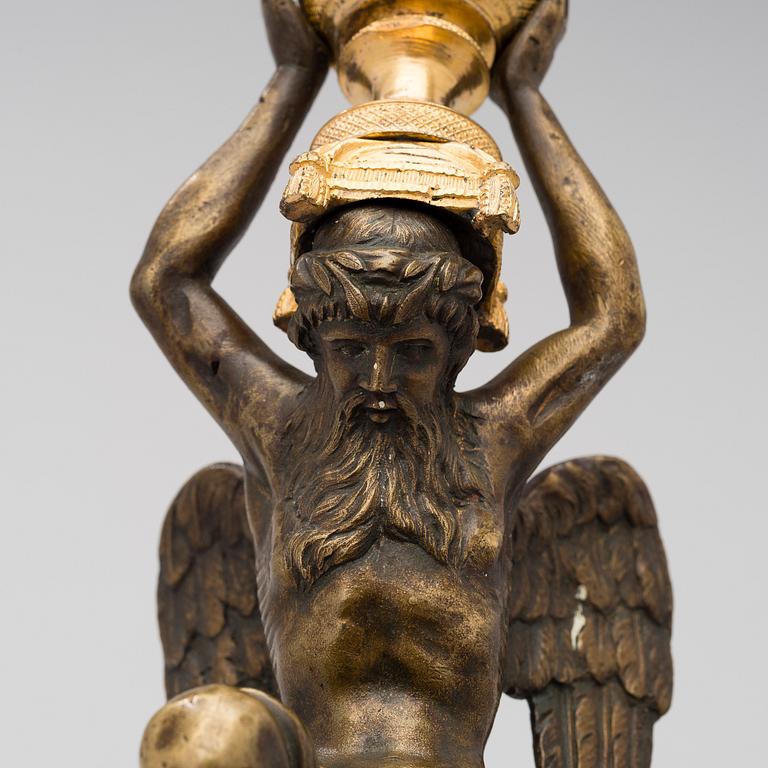 A ORMOLU CANDLESTICK, bronze and gilded bronze, empire early 19th century.