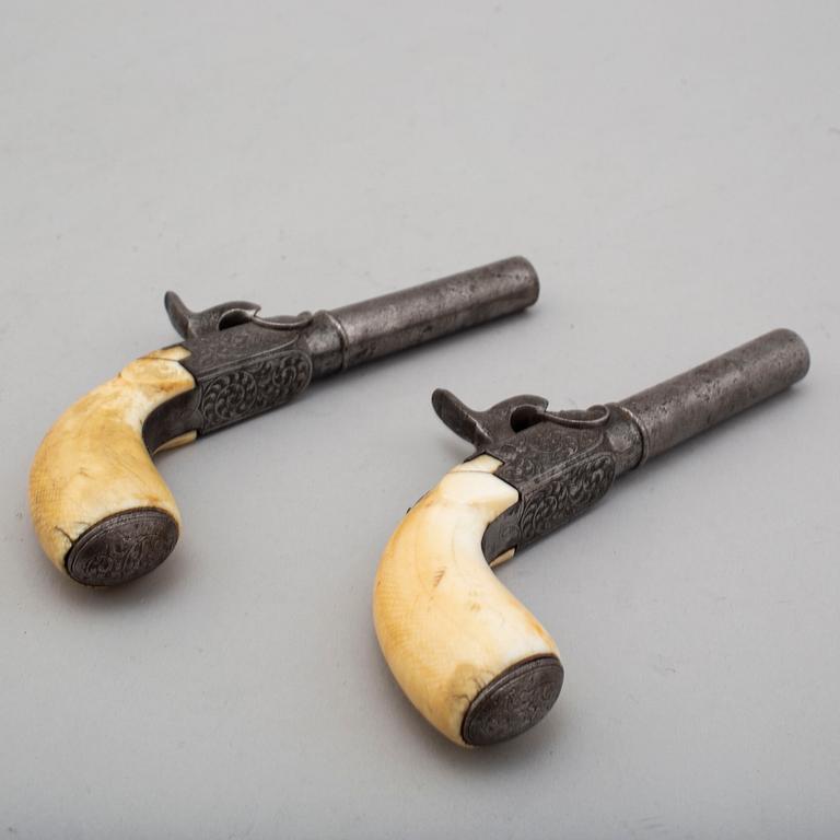 A mid 19th century Belgian rifled percussion pistols with ivory butts in a case.