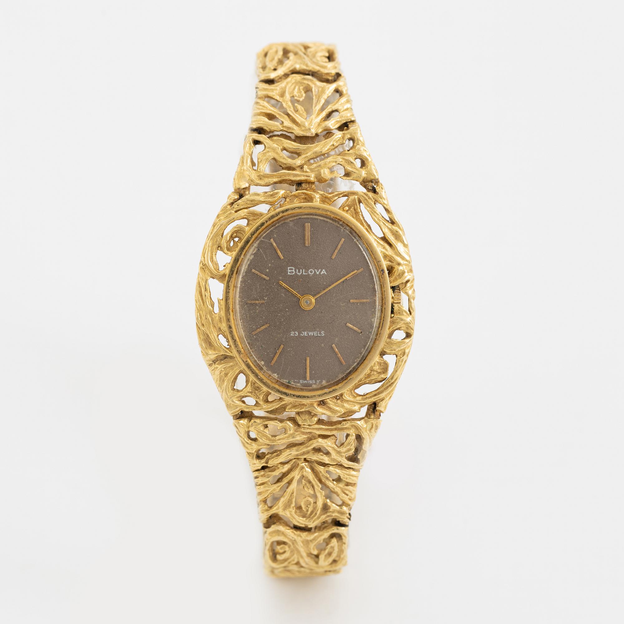 18K gold Bulova watch.
