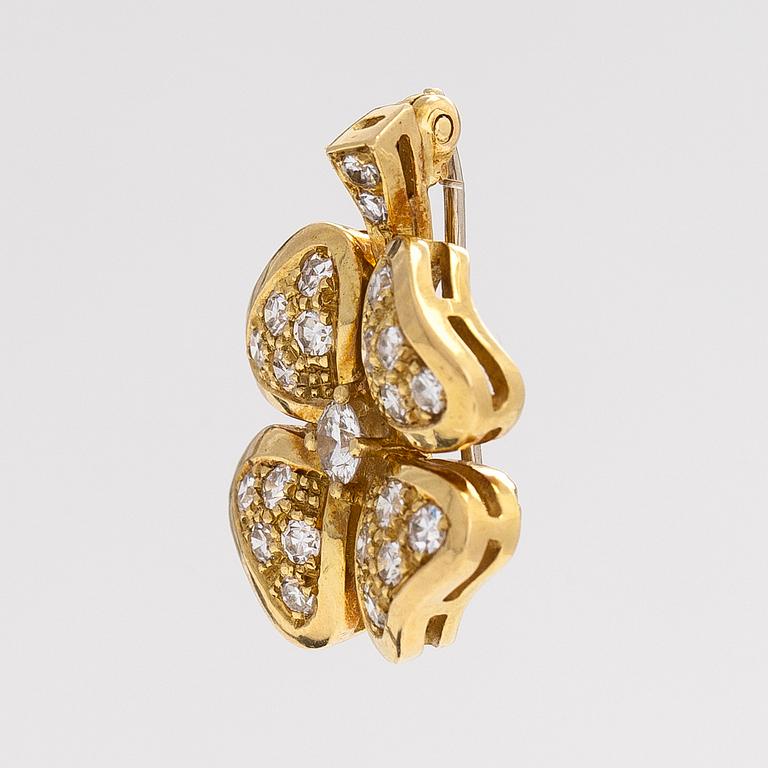 An 18K gold and diamond four-leaf clover brooch/pendant.