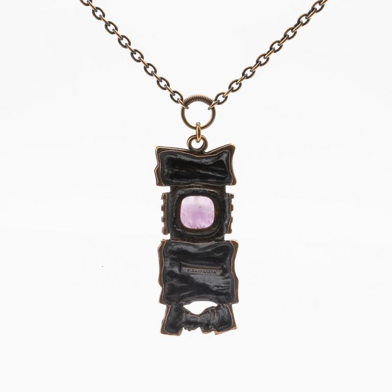 A bronze necklace set with an amethyst by Pentti Sarpaneva.