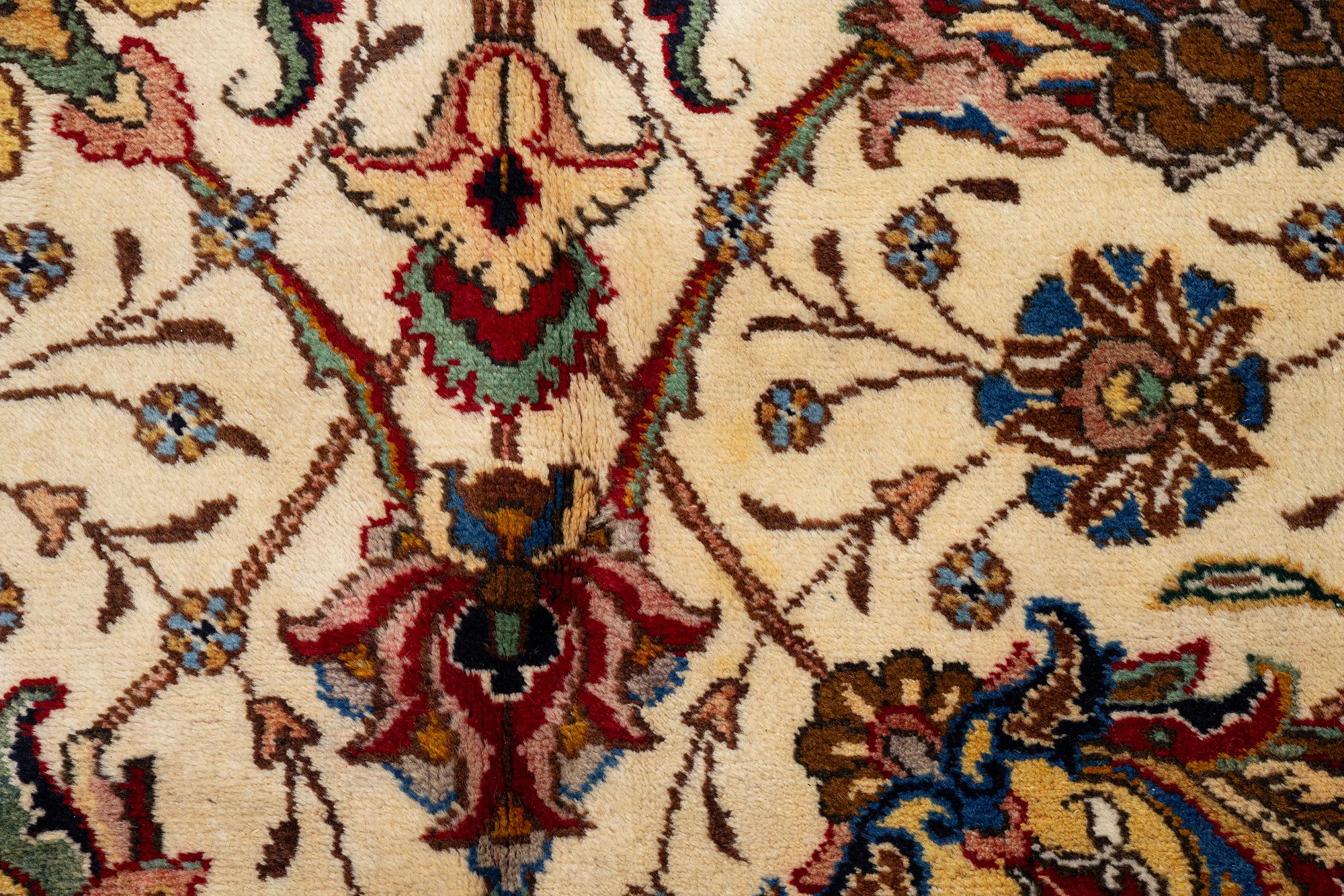 A Tabriz carpet, Northwestern Iran, of Safavid 'palmette' design, c, 483 x 302 cm.