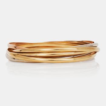 1088. A Cartier "Trinity" bangle with 7 rings.