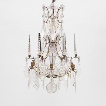 A six-light rococo-style chandelier, late 19th century incorporating older elements.