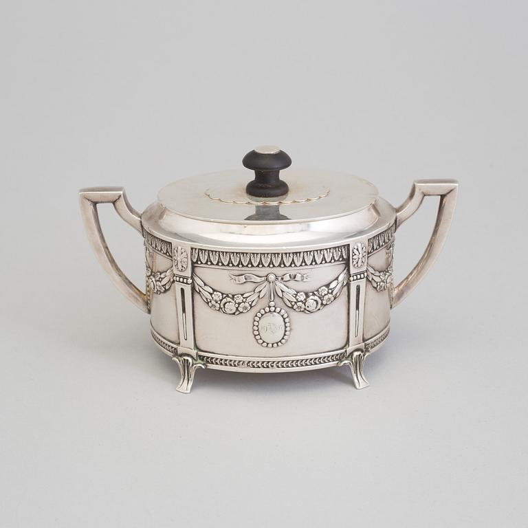 A set of three silver objects (coffeepot, creamer and sugarbowl, CG Hallberg and GAB, Stockholm 1907. Weight ca 1226 gr.