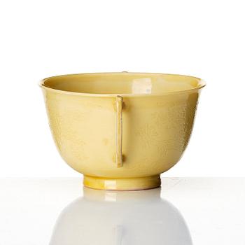 An imperial yellow glazed two handled wine cup, Qing dynasty, Kangxi mark and of the period (1662-1722).