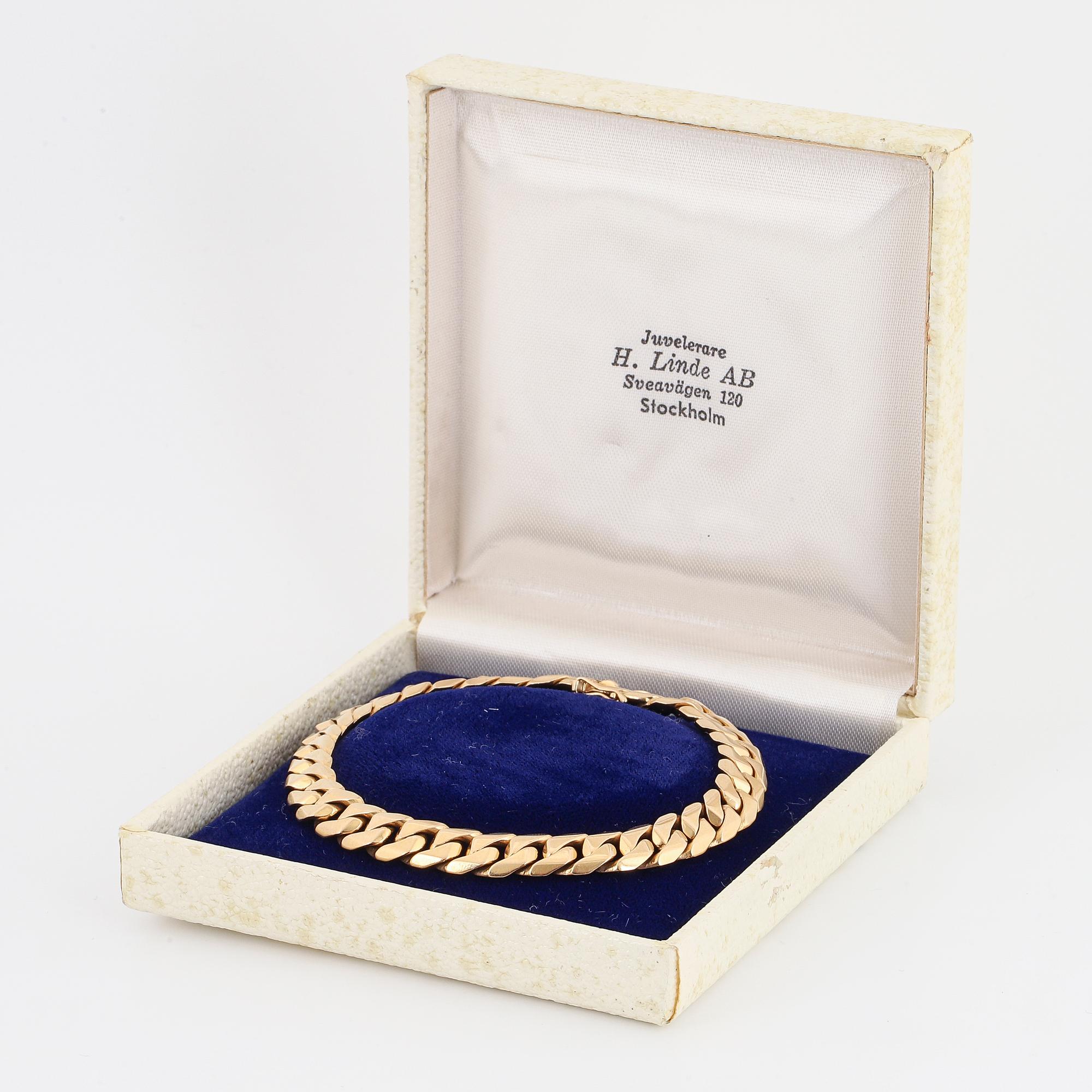 Armband 18K guld manglad pansar.