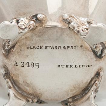 Black Starr & Frost, a pair of sterling silver shakers and sugar bowls, USA around 1900, Gorham pair of sterling spoons.