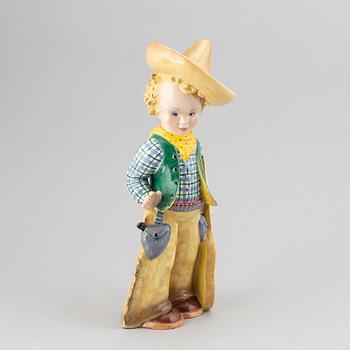 Italiensk keramik, figurin, cowboyklädd gosse med gitarr, troligen 1930-tal.