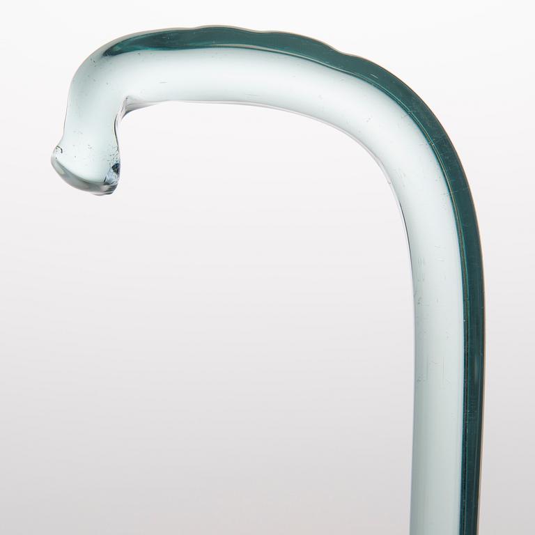 A greenish glass walking stick.