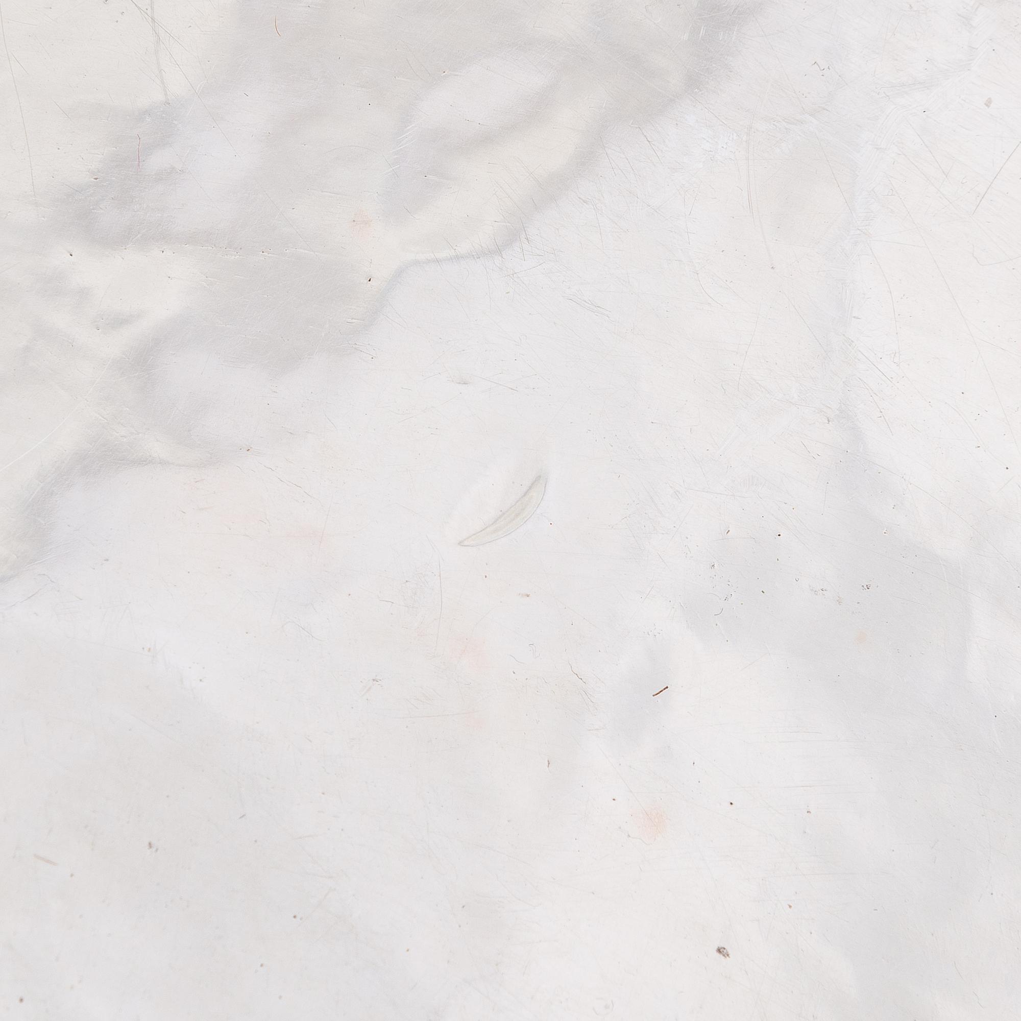 A 12-piece set of sterling silver chargers, Peru 1950s-60s.