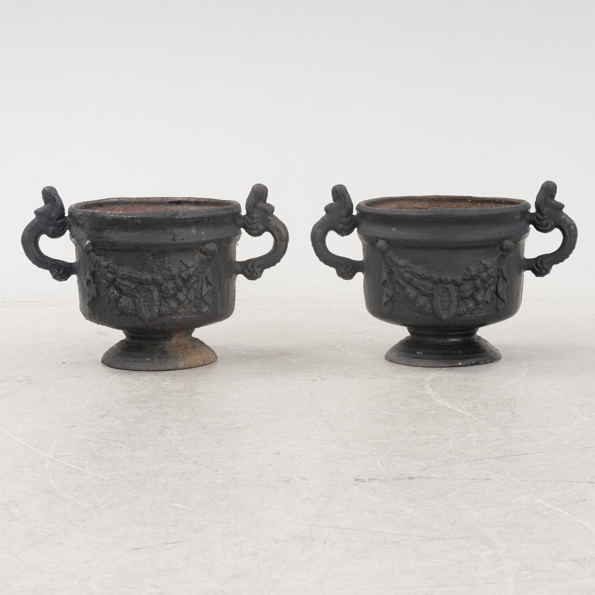 A pair of cast-iron urns from Stafsjö Bruk, 20th Century.