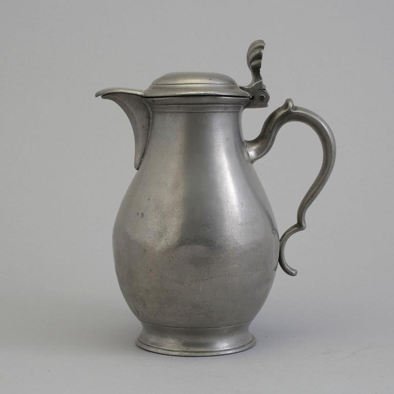 A 18th century tin pot.