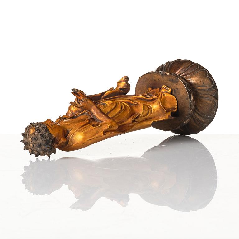 A lacquer figure of a standing Buddha, late Ming dynasty/early Qing dynasty.