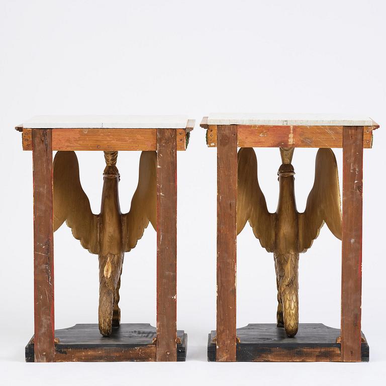 A pair of giltwood console tables, Empire-style incorporating older elements.