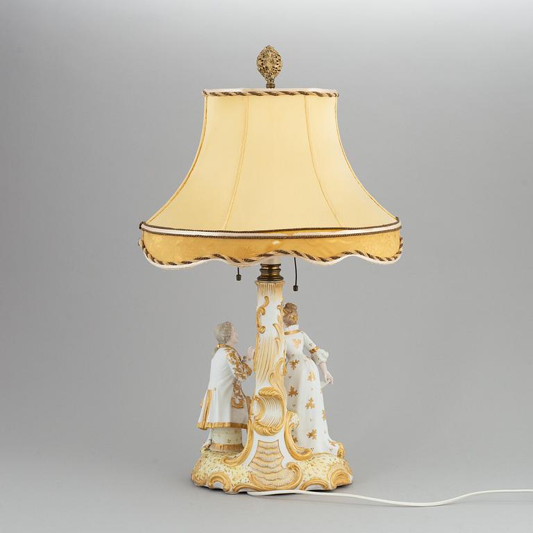 a rococo-style porcelain table lamp from the first half of the 20th century.