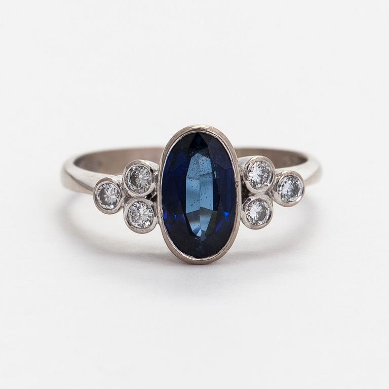 A. Tillander, ring, faceted sapphire, brilliant cut diamonds, 18K white gold, Helsinki 1983.