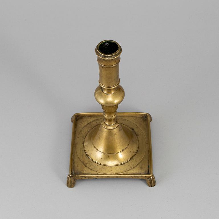 A 17th century bronze candlestick.