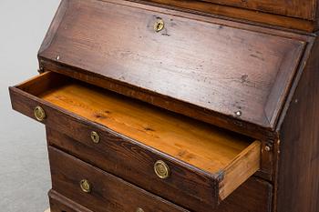 An early 19th Century pine cabinet.