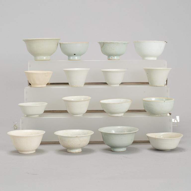 A group of 11 Southeast asian and Chinese white glazed cups, 19th century and also later.