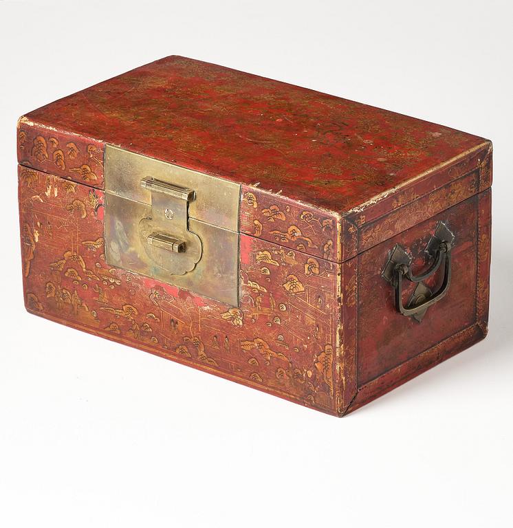 A set of two gilt decorated leather clad wooden chests, late Qing dynasty.