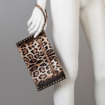A ponyhair clutch with studs by Valentino.