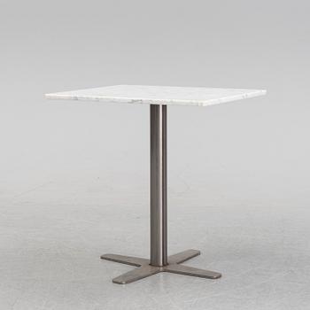 A marble top table, 21th century.