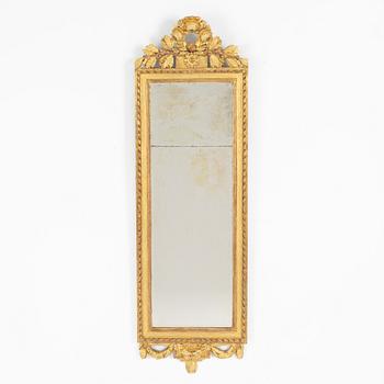 A Gustavian giltwood mirror, Stockholm, late 18th century.