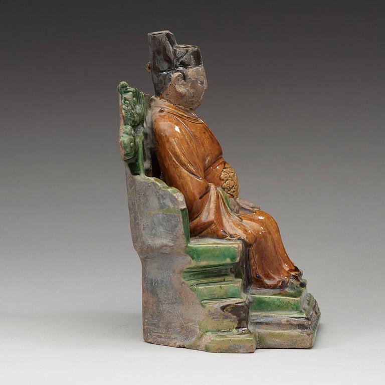 A ceramic sculpture of a seated daoist dignitary, Ming dynasty, (1368-1644).